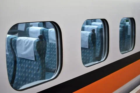 Empty blue cushioned subway train seats Stock Photos