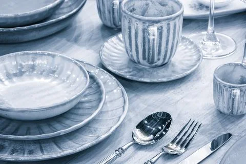 Empty blue gray plate as background.  Dining table setting Foto stock