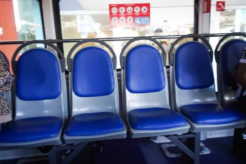 Empty blue passenger seats inside a modern public transportation 写真素材