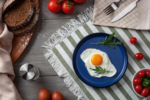 An empty blue plate as serving on the table. Stock Photos