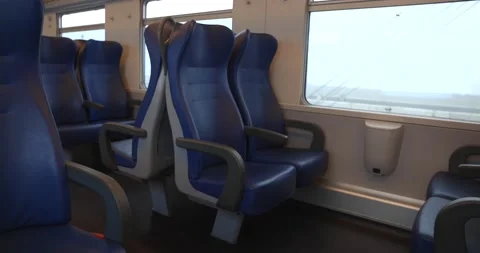 Empty blue seats during pandemic covid 19 with no people in train Stock Footage 150155273
