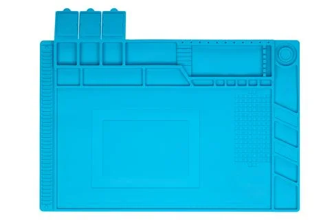 Empty Blue silicone work mat with compartments for tools and components. Foto stock