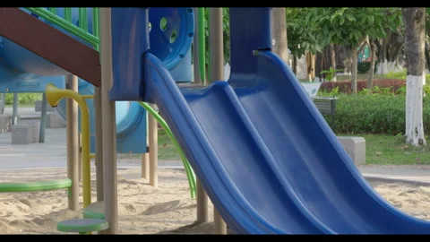 Empty Blue Slide in Outdoor Playground with Sandy Ground Видео 330950602