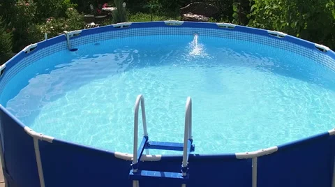 An empty blue swimming pool filled with still water. No people. Slow motion. HD 库存影片 65526057