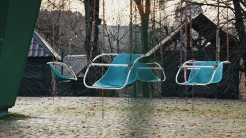 Empty Blue Swing Ride in an Abandoned Park Stock Footage 329681423