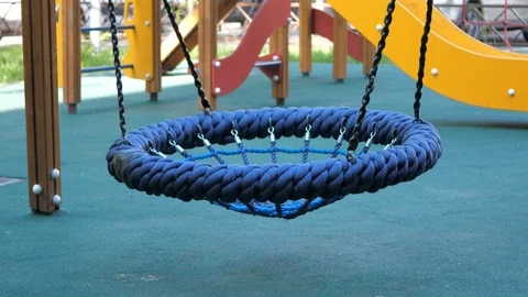 Empty blue swingon the playground Stock Footage 107620287