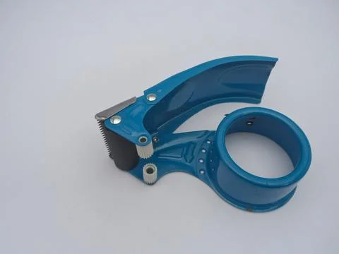 An empty blue tape dispenser without tape, isolated on a white background. Stock Photos