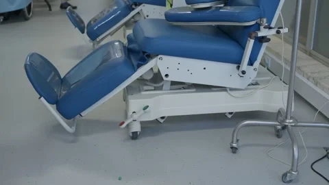 Empty Blue Treatment Chairs and IV Pole in Hospital Clinic 스톡 동영상 346470144