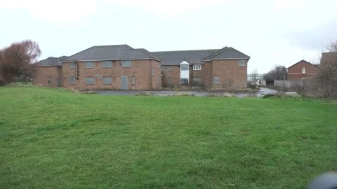 Empty boarded old peoples home from back Stock Footage 260503242
