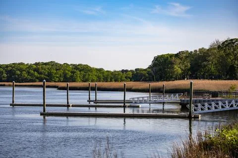 Empty Boat Dock on Calm River Stock Photos