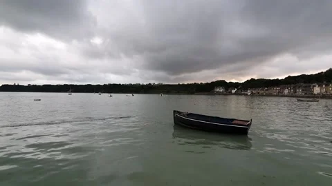Empty boat floating in the sea in a harbour in france Stock Footage 158998043