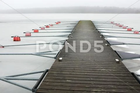 Empty boat park on the lake in winter under the snow Stock Photos
