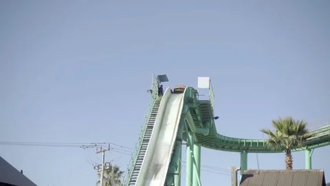 Empty boat splashing down roller coaster water ride in amusement park  Video stock 70039329