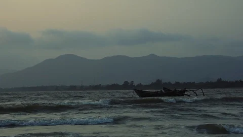 Empty boats floating on sea waves in late rain evening. Stock Footage 109102811