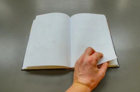 An empty book and hand Stock Photos