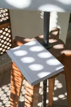Empty book mockup on flor lamp, shadow overlay Stock Photos
