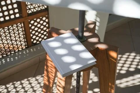 Empty book mockup on flor lamp, shadow overlay Stock Photos