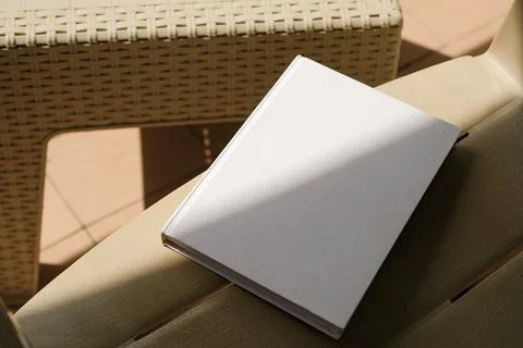 Empty book mockup on plastic table tile floor in the room, shadow overlay Stock Photos
