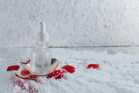 An empty bottle with a broken New Year's toy Stock Photos