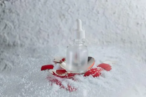 An empty bottle with a broken New Year's toy Stock Photos
