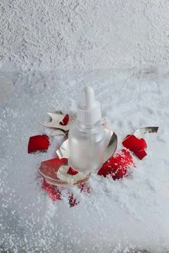 An empty bottle with a broken New Year's toy Stock Photos
