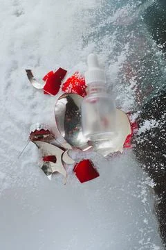 An empty bottle with a broken New Year's toy Stock Photos