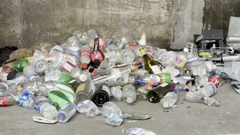 Empty bottle litter the sidewalk of Downtown Los Angeles Stock Footage 164702404