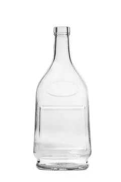 An empty bottle of an unusual shape made of transparent glass for cognac, w.. Stock Photos
