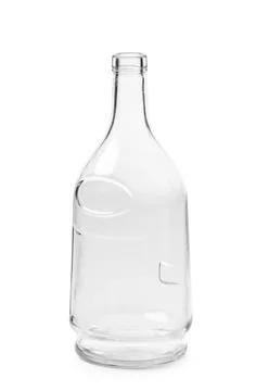 An empty bottle of an unusual shape made of transparent glass for cognac, w.. Foto stock