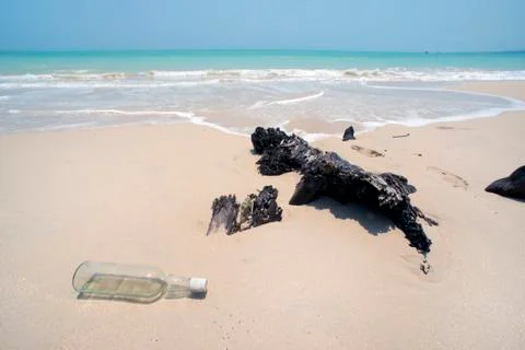 Empty bottle at white sand beach Khao lak Фото