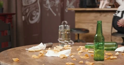 Empty bottles on a dirty restaurant table after customers left Stock Footage 104867256