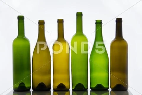 Empty bottles of wine on white background Stock Photos
