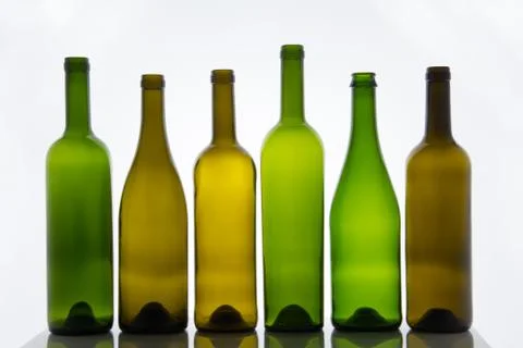 Empty bottles of wine on white background