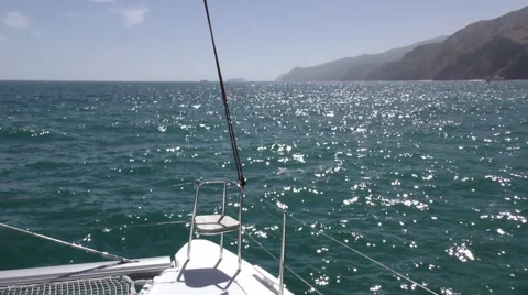 Empty bow sea of right hull in foreground  and island in background Stock Footage 68002384