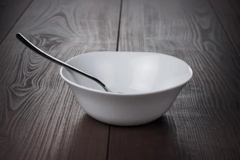 Empty bowl with spoon Stock Photos