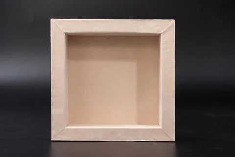 An empty box on a black background. casket. 스톡 사진