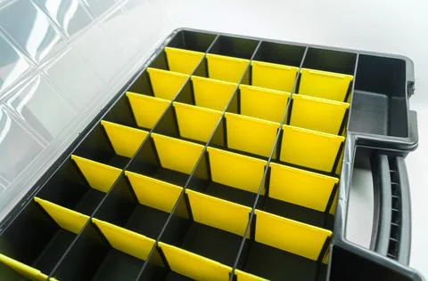 Empty box with cells for storing small parts and fasteners. Sectional tool box Stock Photos