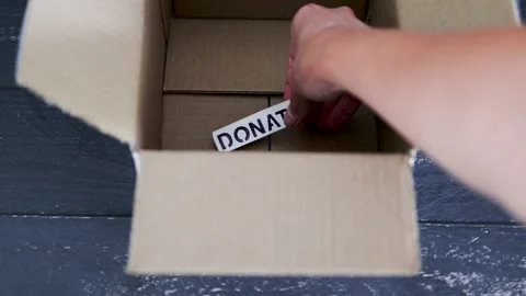 Empty box with Donate label for second-hand items to be given away, charity d Video stock 148127592