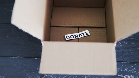 Empty box with Donate label for second-hand items to be given away, charity d Video stock 148127627