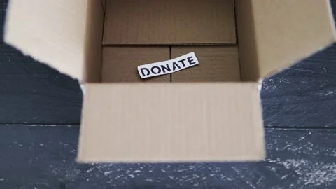 Empty box with Donate label for second-hand items to be given away, charity d Video stock 148127630