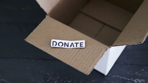 Empty box with Donate label for second-hand items to be given away, charity d Video stock 148127637