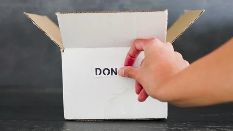 Empty box with Donate label for second-hand items to be given away, charity d Video stock 148127658