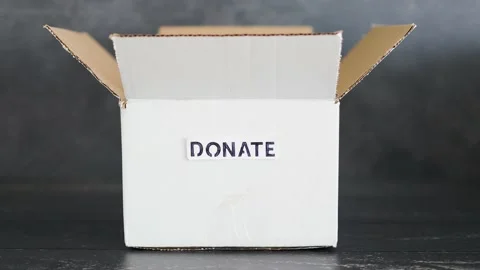 Empty box with Donate label for second-hand items to be given away, charity d Video stock 148127664