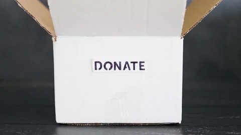 Empty box with Donate label for second-hand items to be given away, charity d Video stock 148127683