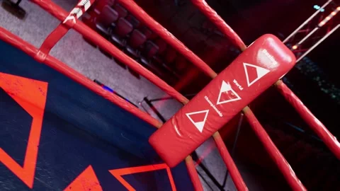 Empty boxing arena waiting new round. Red corner . fly camera 4k hi quality Stockbeeldmateriaal 152858859