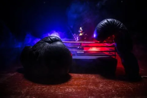 Empty boxing ring with red ropes for match in the stadium arena. Creative art Stock Photos