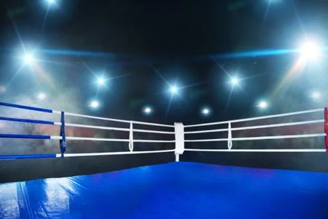Empty boxing ring, view on corner with white ropes Stock Photos