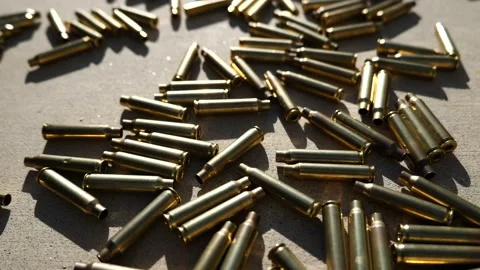 Empty brass shells littering the ground Stock Footage 221955947