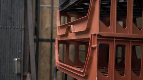 Empty bread crates stacked outside a shop close up tilting shot Stock Footage 139225729