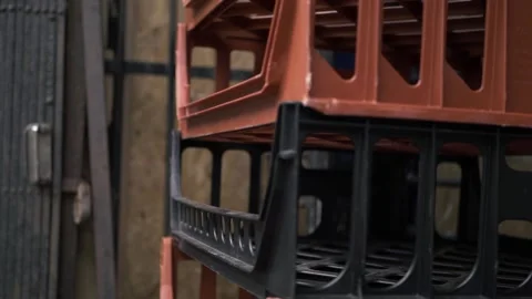 Empty bread crates stacked outside a shop close up panning shot Stock Footage 139225736